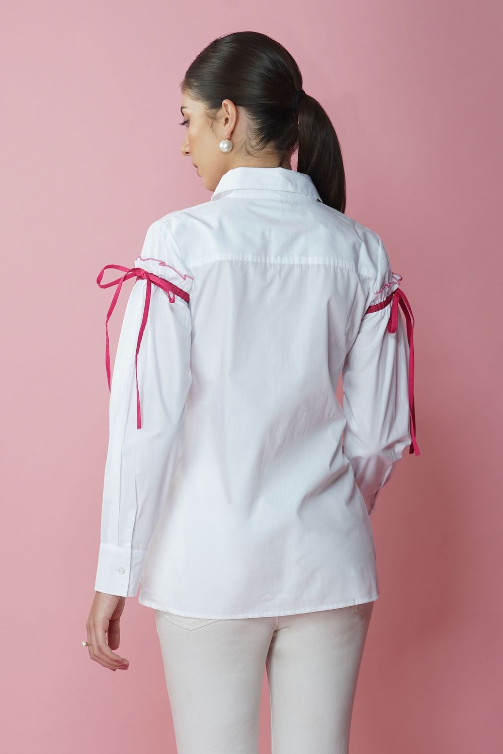 White shirt with maroon piping and knots on sleeves