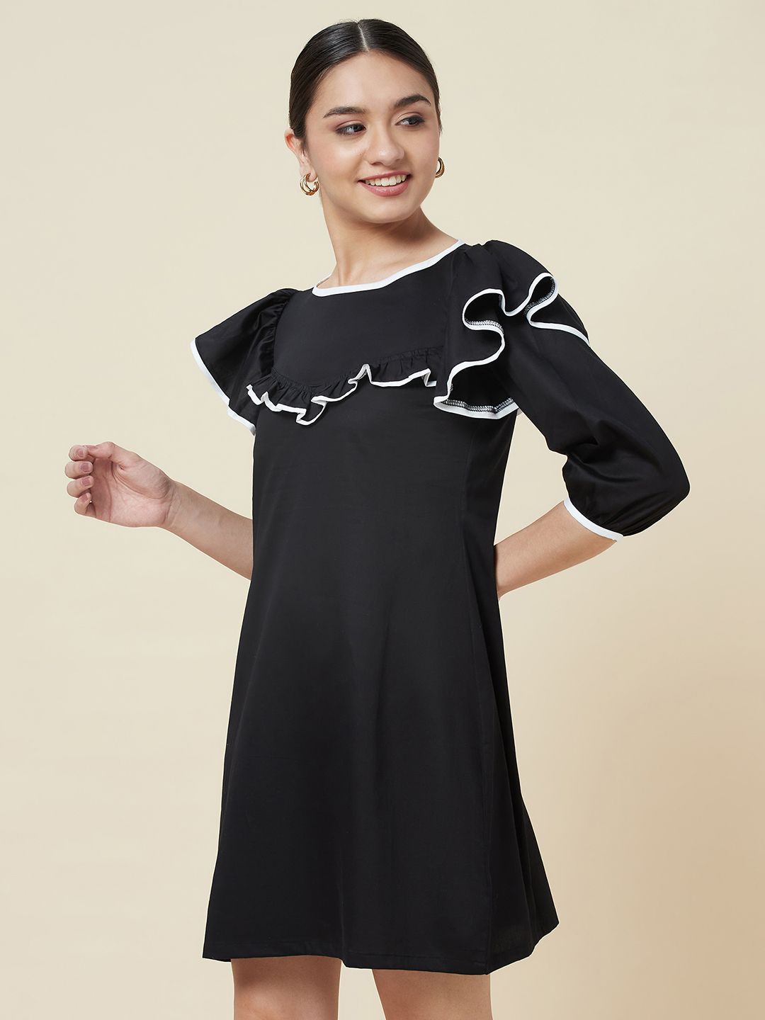 Black a-line frill neck dress with white piping detailing