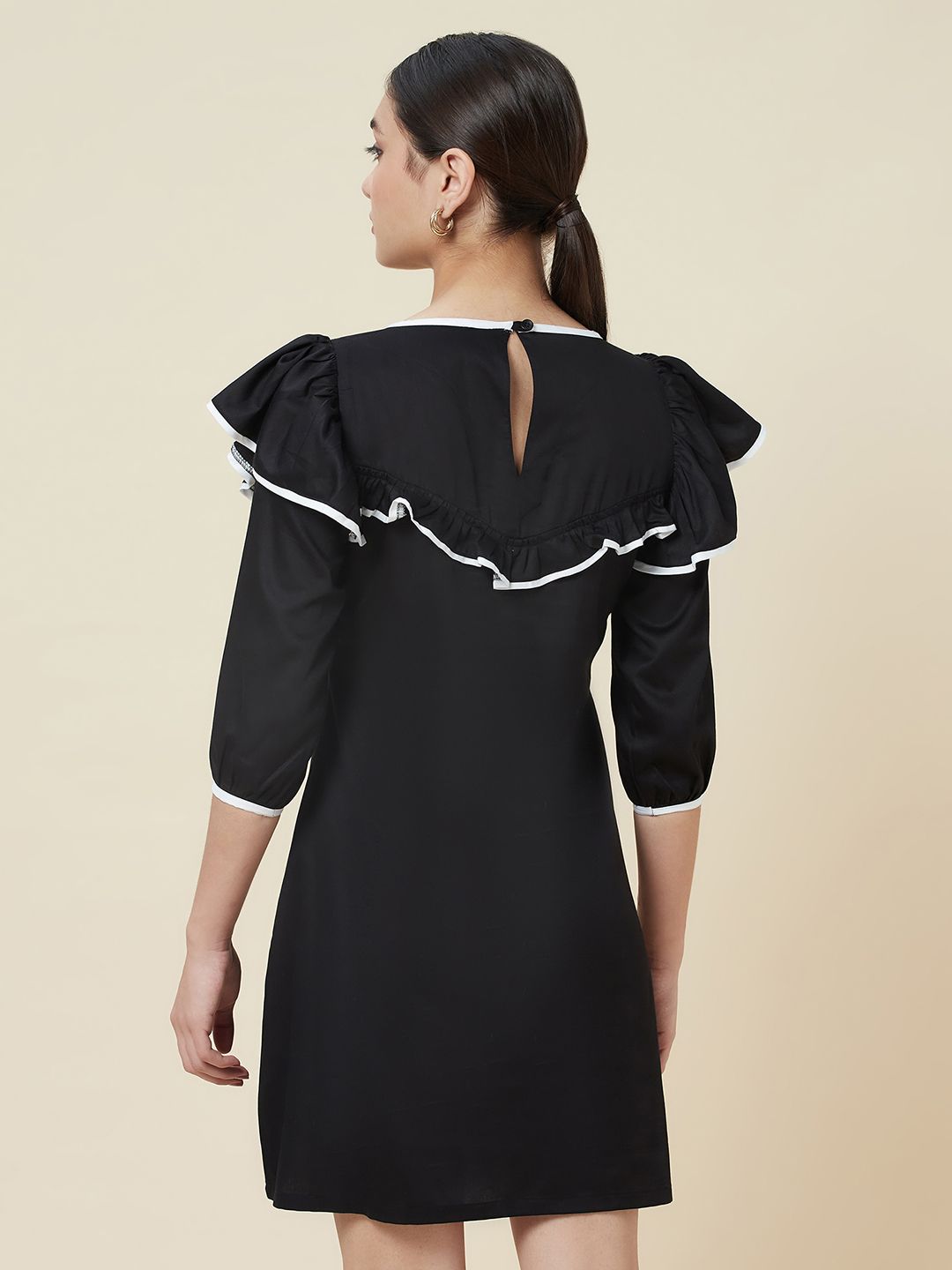 Black a-line frill neck dress with white piping detailing