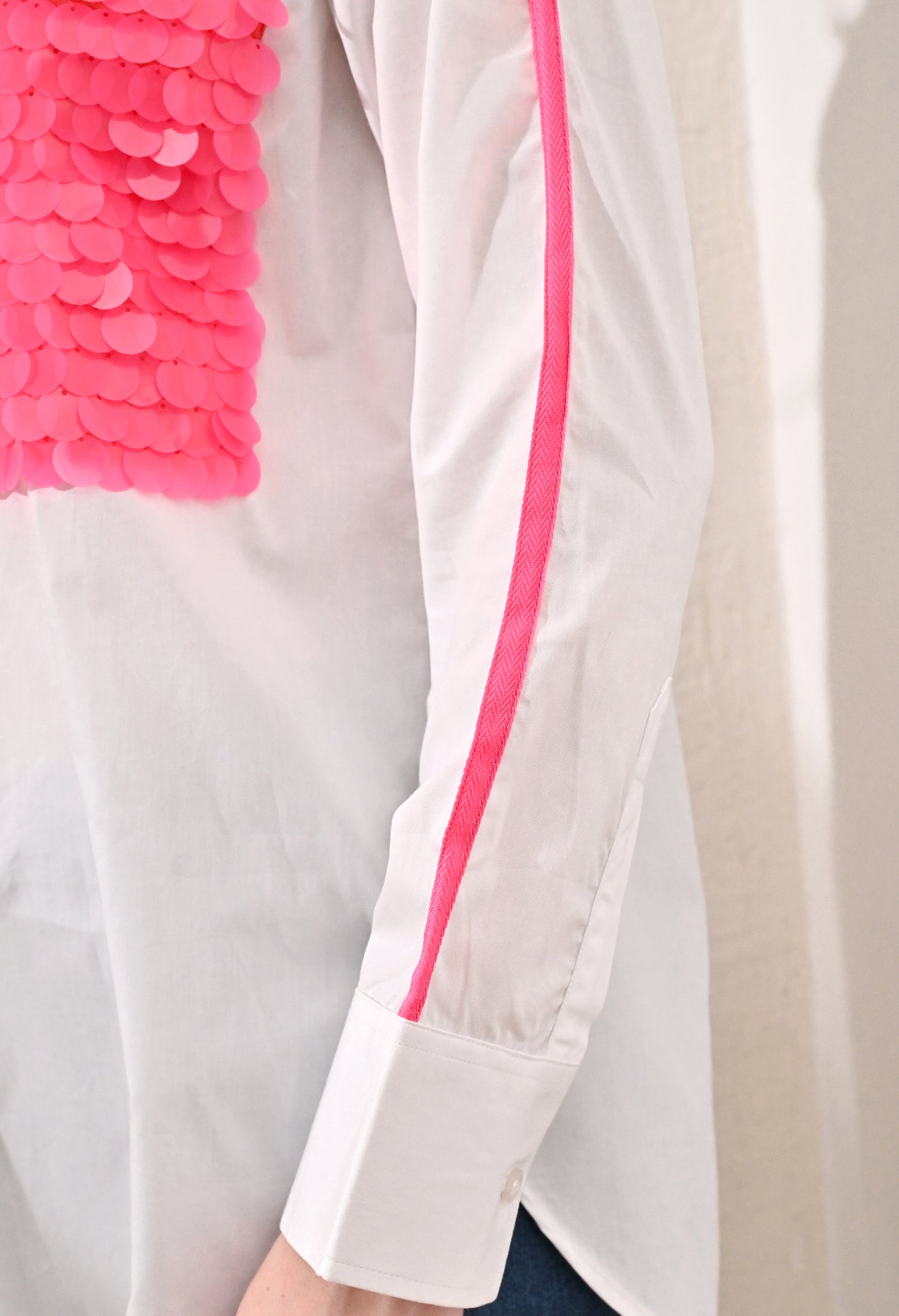 White shirt with neon pink sequence patch pockets