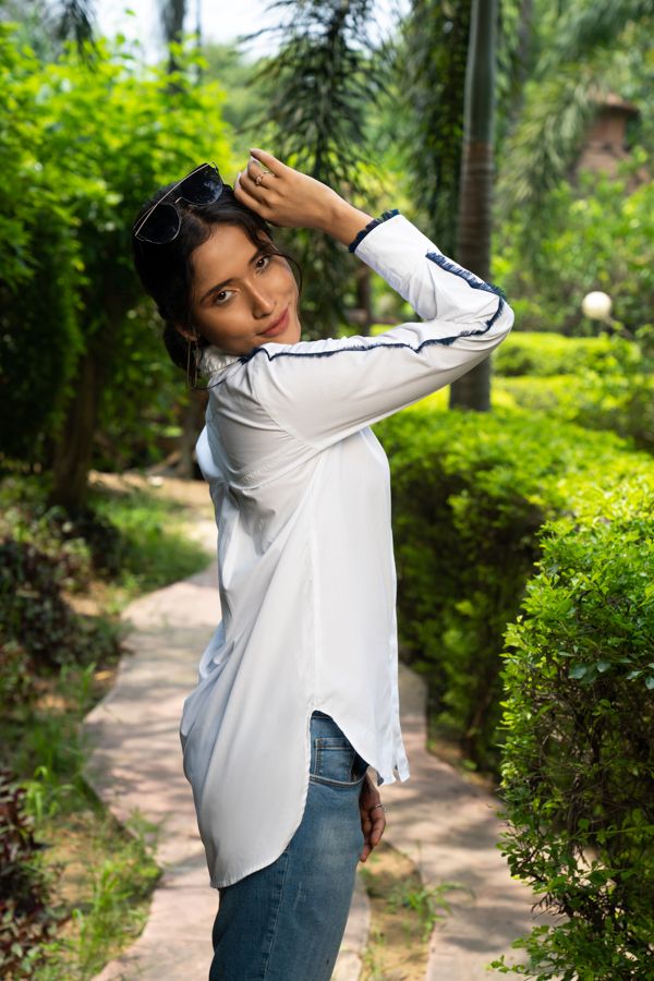 White shirt with denim fringes on sleeves